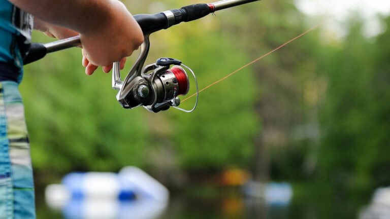 person holding fishing reel